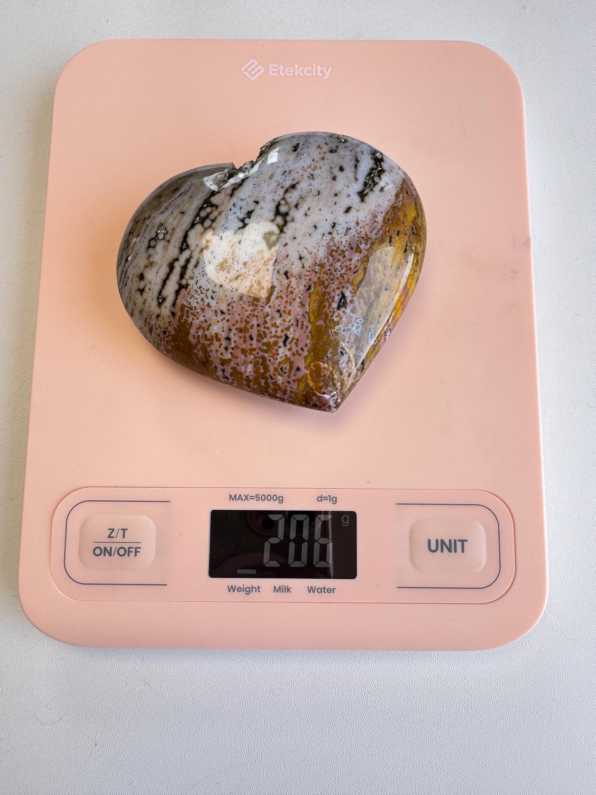An Ocean Jasper Heart from Madagascar - Item C is shown on a pink digital kitchen scale with a display reading 200 grams.